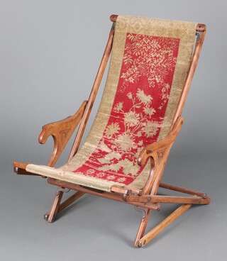 A late Victorian beech framed, campaign style, patented rocking chair with carpet upholstered seat, the base with spring 89cm h x 64cm w x 87cm d (seat 30cm x 40cm) 