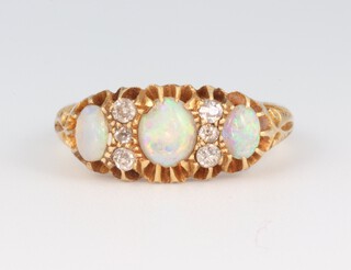 A Victorian 18ct yellow gold opal 1.0ct and diamond 0.4ct ring, size L, 3.9 grams 