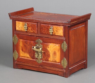 A Chinese figured walnut trinket box in the form of a cabinet, fitted 2 drawers above a cupboard enclosed by panelled doors 27cm h x 34cm w x 20cm d 