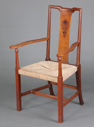 An Art Nouveau inlaid oak slat back carver chair with woven seat, raised on square supports with H framed stretcher 104cm x 63cm x 54cm (seat 24cm x 27cm) 