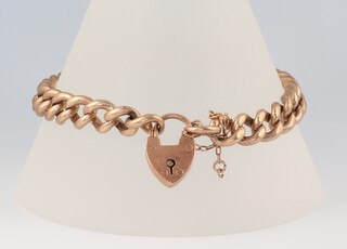 A 9ct yellow gold bracelet with heart shaped padlock, 18cm, 32 grams