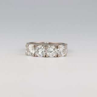 A 14ct white gold 4 stone diamond ring stamped Manning, 2ct, 4.9 grams, size J 1/2