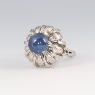 A 14ct white gold star sapphire dress ring 7.3 grams, size G 