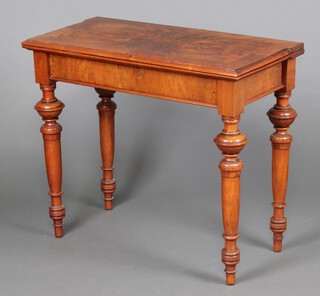 A 19th Century Continental quarter veneered figured walnut tea table, raised on turned supports 74cm h x 87cm w x 43cm d 