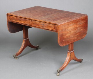 A Georgian inlaid and crossbanded mahogany sofa table, fitted 2 frieze drawers, raised on standard end supports, brass caps and casters 72cm h x 96cm w x 63cm d 