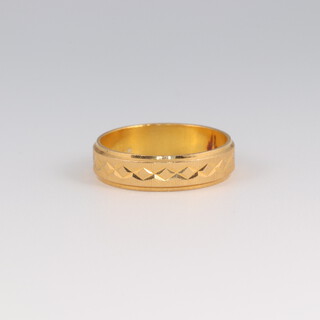 A 22ct yellow gold bright cut wedding band size L 1/2, 3.6 grams 