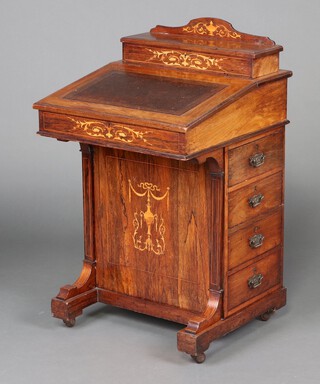 A Victorian inlaid rosewood Davenport desk, the upper section fitted stationery box with hinged lid, the fall front with leather writing surface revealing 2 short drawers, the pedestal fitted 4 drawers with brass drop handles, 90cm h x 53cm w x 54cm d  