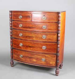 A Georgian inlaid mahogany bow front chest of 2 short and 4 long drawers with replacement drop and handles and columns to the sides 120cm h x 109cm w x 47cm d 