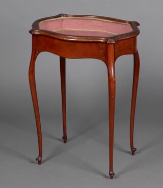 An Edwardian bijouterie table of serpentine outline, raised on cabriole supports 74cm h x 56cm w x 42cm d