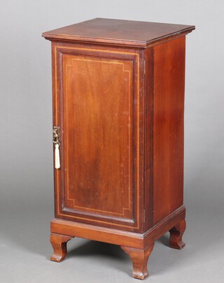 An Edwardian inlaid mahogany cabinet enclosed by a panelled door, raised on bracket feet 96cm h x 46cm w x 46cm d 