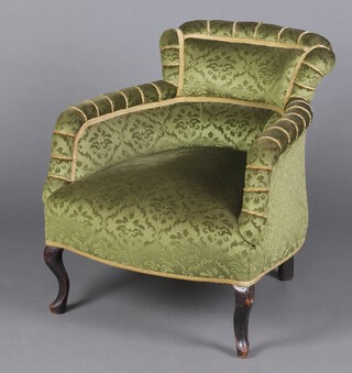 A Victorian tub back chair upholstered in green material, raised on cabriole supports 68cm h x 64cm w x 54cm d 