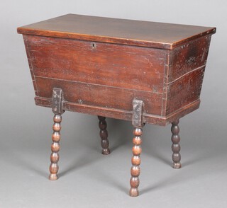 An 18th Century rectangular elm bread proving bin, raised on bobbin turned supports 79cm h x 89cm w x 48cm d 