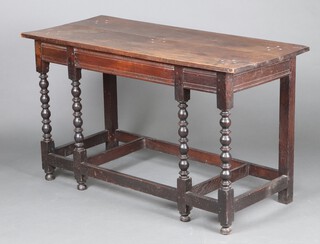 A 19th Century oak altar table, the top carved 5 crosses, raised on turned supports 78cm h x 134cm w x 59cm d 