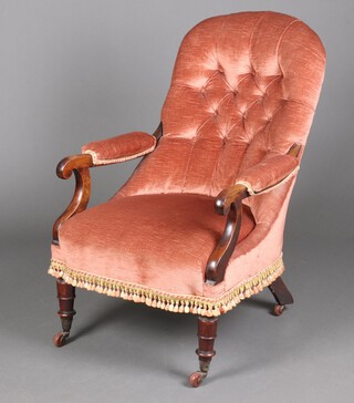 A William IV show frame mahogany open arm chair, the back upholstered in rose buttoned material, raised on turned supports 90cm h x 64cm w x 53cm d (seat 27cm x 37cm) 
