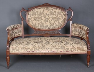 A Victorian carved walnut 8 piece drawing room suite comprising show frame sofa 98cm h x 137cm w x 55cm d (seat 110cm x 43cm), a pair of open arm chairs 93cm x 59cm x 52cm (32cm x 36cm), a pair of nursing chairs 80cm x 44cm x 42cm (24cm x 30cm) and 3 splat back dining chairs, the splats heavily carved 92cm x 43cm x 41cm (22cm x 27cm) raised on turned supports 