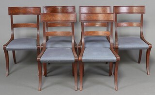 A set of 6 19th Century bar back dining chairs with plain mid rails and over stuffed seats, raised on sabre supports 86cm h x 46cm w x 41cm d 