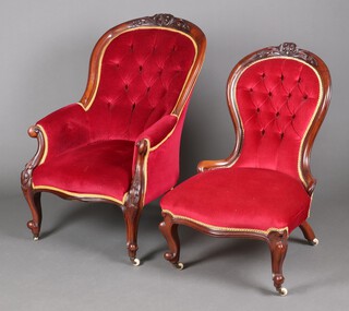 A Victorian mahogany show frame tub back armchair upholstered in red material, the seat of serpentine outline, raised on cabriole supports 100cm h x 65cm w x 46cm d, together with a matching nursing chair 92cm h x 60cm w x 52cm d 