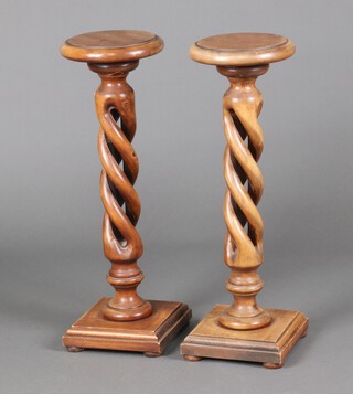 A pair of beech framed spiral turned jardiniere stands, raised on square bases 70cm h x 23cm diam. 