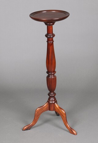 A Georgian style mahogany torchere, raised on a pillar and tripod base 92cm h x 30cm diam. 
