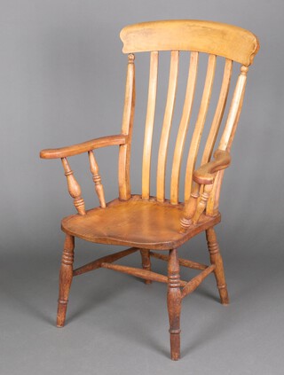An unmarked, 19th Century, elm and beech stick and bar back Windsor kitchen carver chair, raised on turned supports with H framed stretcher 110cm h x 73cm w x 46cm d (seat 30cm x 30cm) 