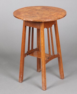 An Edwardian Art Nouveau circular inlaid oak occasional table with rectangular undertier, raised on square supports 71cm h x 49cm diam. 