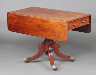 A Victorian bleached mahogany Pembroke table, raised on a bulbous turned column and triform base with brass paw feet 71cm h x 102cm w x 51cm d 