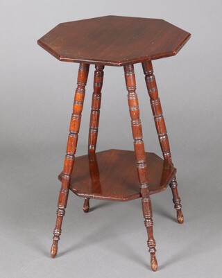 An Edwardian octagonal mahogany 2 tier occasional table, raised on turned supports 56cm h x 41cm w x 42cm d 