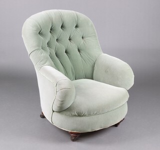 A Victorian metal framed tub back armchair upholstered in green buttoned material, raised on turned supports 87cm h x 71cm w x 60cm d (seat 24cm x 35cm) 
