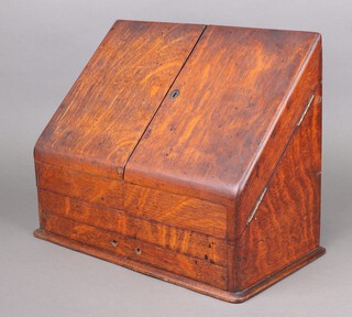 A Victorian wedge shaped oak stationery box, interior part missing, the base fitted a secret drawer 30cm x 37cm x 20cm 