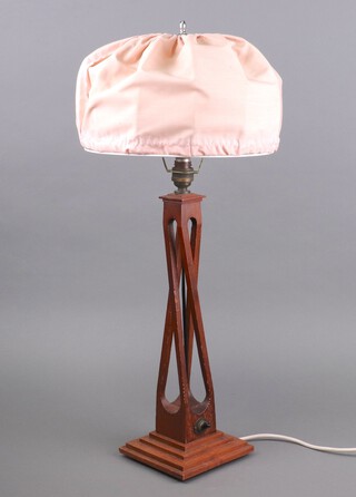 An Art Deco carved oak table lamp, raised on a stepped base 40cm x 15cm x 15cm 
