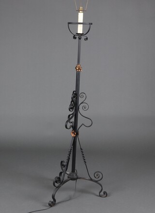 A Victorian wrought iron adjustable standard oil lamp, converted to a standard lamp 133cm h x 45cm 