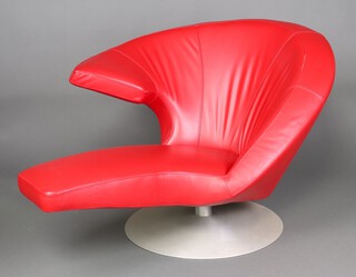 Stefan Heiliger for Leolux, a red leather 'Parabolica' easy chair, raised on a brushed aluminium revolving base 78cm x 121cm x 103cm