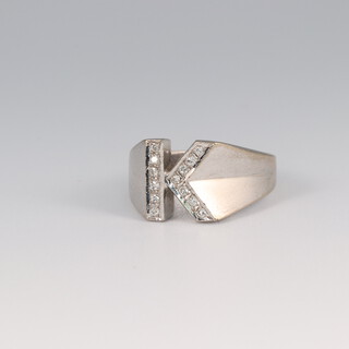 A 14ct white gold diamond set letter "K" ring, size I, 5.2 grams 
