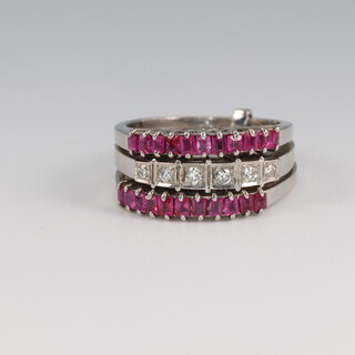 A white gold, testing as 9ct, ruby and diamond triple ring size H, 7.1 grams 