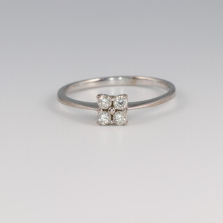 An 18ct yellow gold 4 stone diamond ring, 2.3 grams, approx 0.25ct, size O 1/2