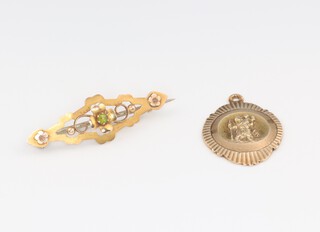 A 9ct yellow gold St Christopher pendant together with a peridot set brooch, 4.6 grams 