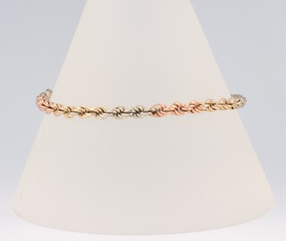 A 9ct two colour yellow gold rope twist bracelet 18cm (a/f), 3.1 grams 