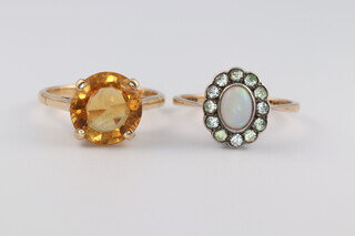 A 9ct yellow gold citrine ring size O, a ditto oval opal ring size P, 6 grams 