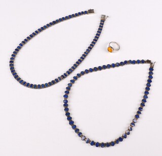 A silver and lapis lazuli necklace 43cm, a ditto 42cm and a silver ring size K, gross weight 76 grams