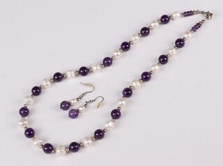 A cultured pearl and amethyst bead necklace, 48cm and a pair of ditto earrings 