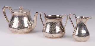 A Victorian silver 3 piece tea set with engraved scroll decoration and armorial, the teapot with ivory resistors, Birmingham 1855, 1238 grams gross Ivory Exemption Certificate QVL7V6QV
