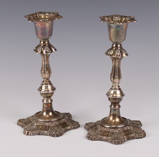 A pair of silver Queen Anne style waisted candlesticks with shell bases Birmingham 1966, maker Hampton Utilities 21cm 