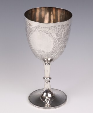 An Edwardian silver trophy cup with vacant cartouche decorated with ferns and leaves, 24cm, Sheffield 1902, 324 grams