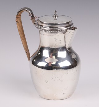 An Edwardian silver jug with wicker covered handle, Birmingham 1908, 12cm, 170 grams gross 