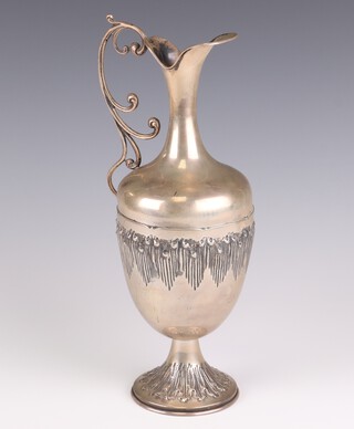 A Continental repousse silver classical style ewer, gross weight 510 grams, 32cm 