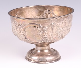 An Edwardian silver repousse pedestal bowl decorated with flowers and swags and with vacant cartouche, Birmingham 1906, 18cm, 312 grams 