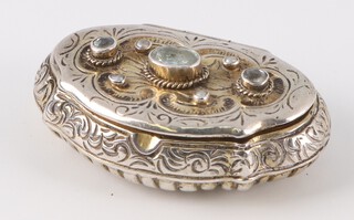 A Continental cast and engraved silver pill box decorated with paste stones, 35mm, 24 grams 