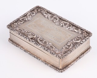 A Victorian rectangular cast and engraved table snuff box with gilt interior and presentation inscription "Presented to Thomas Burleigh of Guernsey of a mark of esteem for his integrity and sterling work by his friend John Mowlem 1847" Birmingham 1847, maker Yapp and Woodward (John Yapp and John Woodward) 10.5cm, 276 grams 