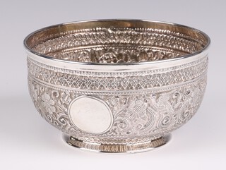 A Victorian repousse silver bowl decorated with scrolling flowers and vacant cartouche, London 1888, 13cm, 198 grams