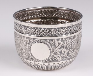 A Victorian repousse silver deep bowl decorated with scrolling flowers and vacant cartouche London 1897, 6cm, 78 grams 